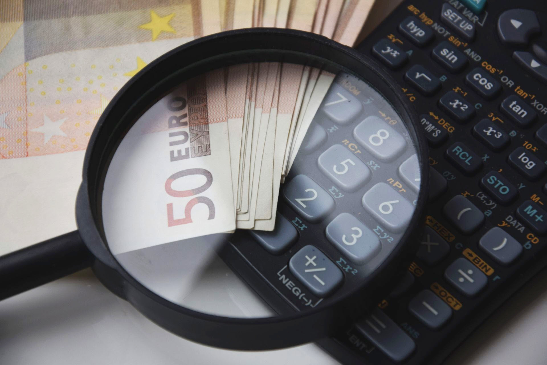 Magnifying Glass on top of the Calculator is being used to explain margin trading.