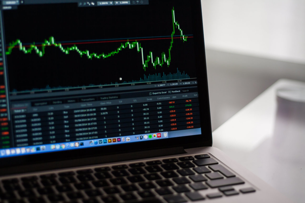 Opened lap-top with the EUR/USD chart on it at one of the Broker's platform.