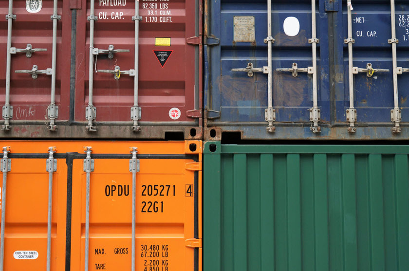 Freight containers, representing Logistics in Forex Fundamental Analysis.