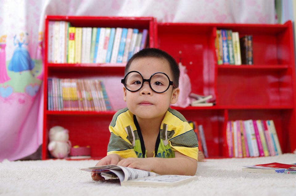 Boy in a glasses is learning all about the global macro hedge fund strategies.