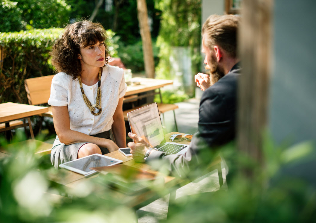 A woman and a man are talking about an Online Forex Trading Account. 