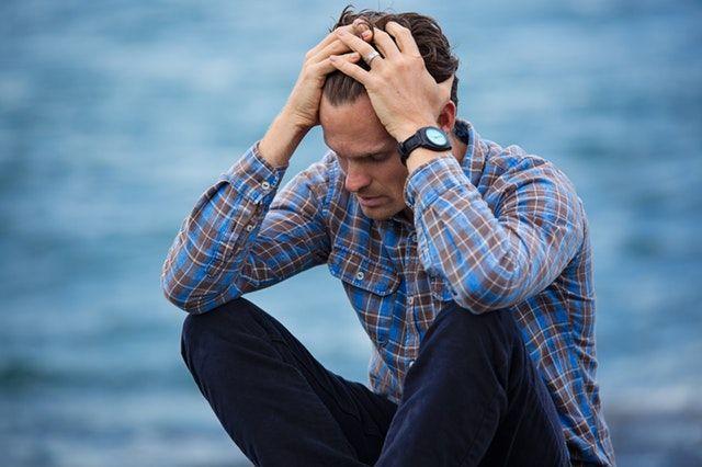 picture of a sitting male with currency market exchange thoughts