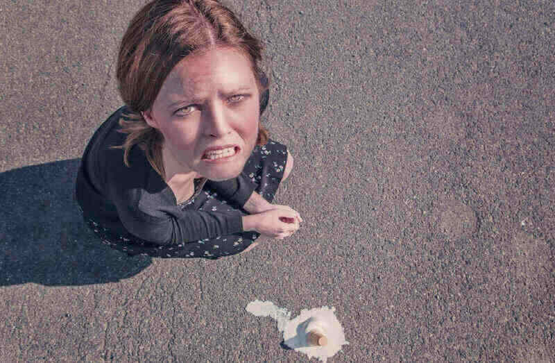 image of an upset woman, embodying the concept of importance of forex trading psychology tips in trading